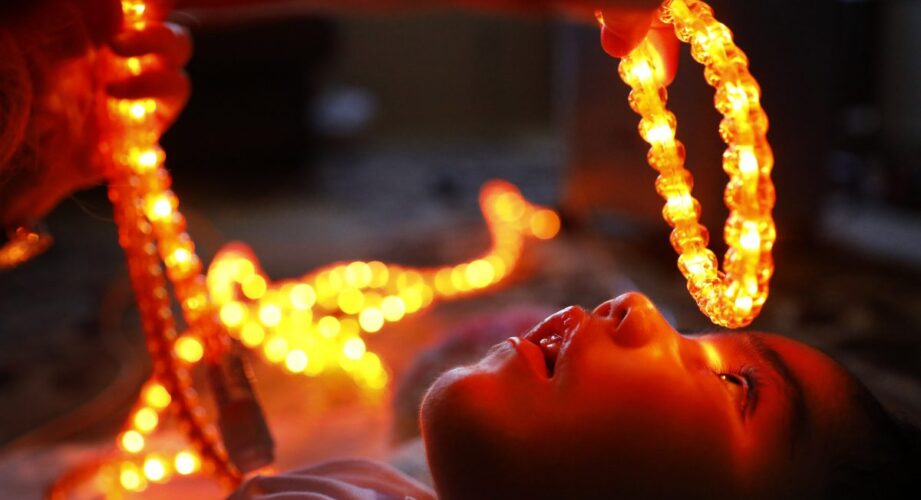 A mobility and orientation specialist slowly moves an amber rope light above D'ashon Morris' eyes during a visual stimulation therapy appointment at his Mesquite, Texas home, Tuesday, March 6, 2018 (Tom Fox/The Dallas Morning News)